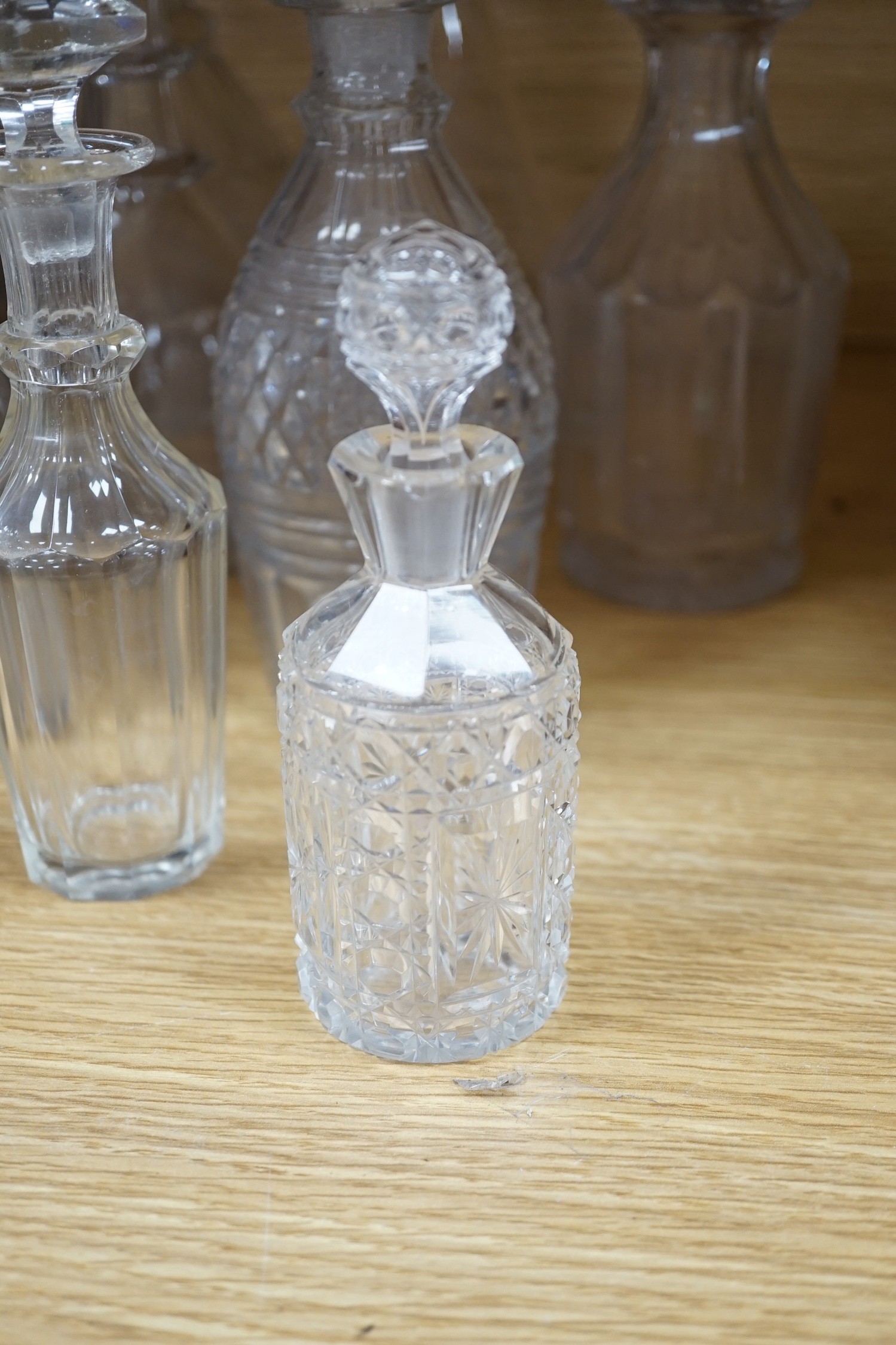 Twelve glass decanters and a carafe (13)